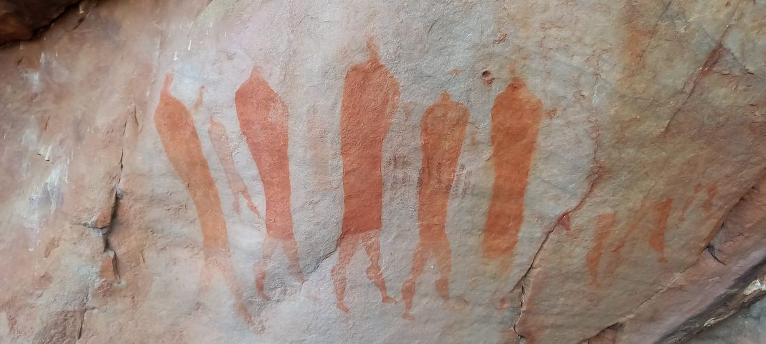 San rock art figures painted in ochre